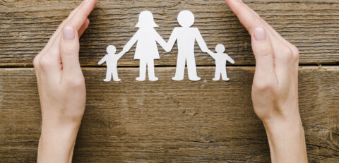 top-view-paper-family-composition-wooden-background